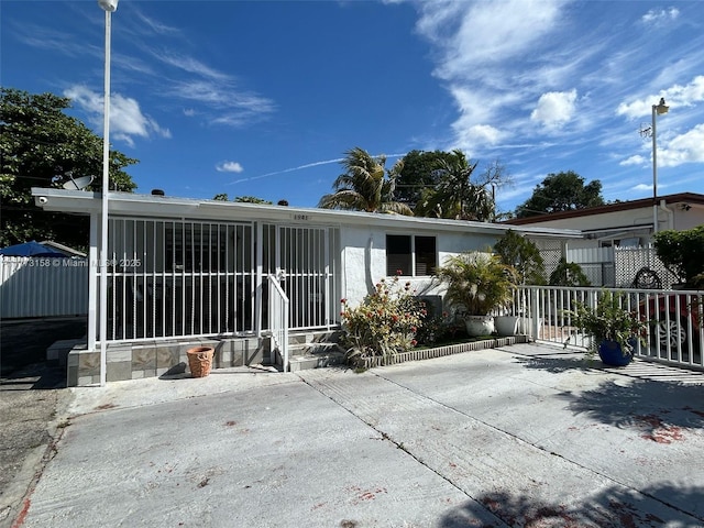 1941 NW 113th Ter, Miami, FL 33167 - rear view of house with a patio area