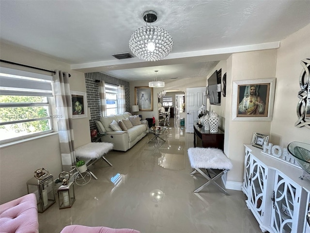 living area with tile patterned floors and a textured ceiling