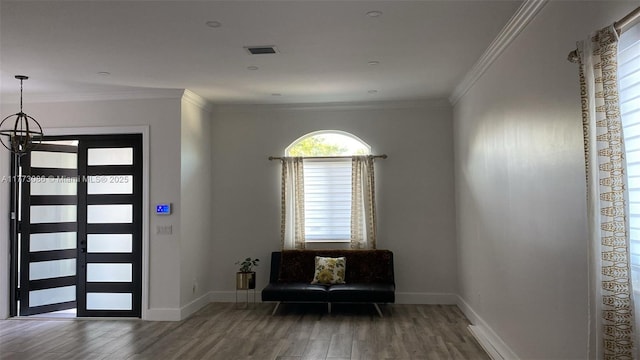11845 SW 3rd St, Miami, FL 33184 - foyer with wood finished floors, ornamental molding, baseboards, and visible vents