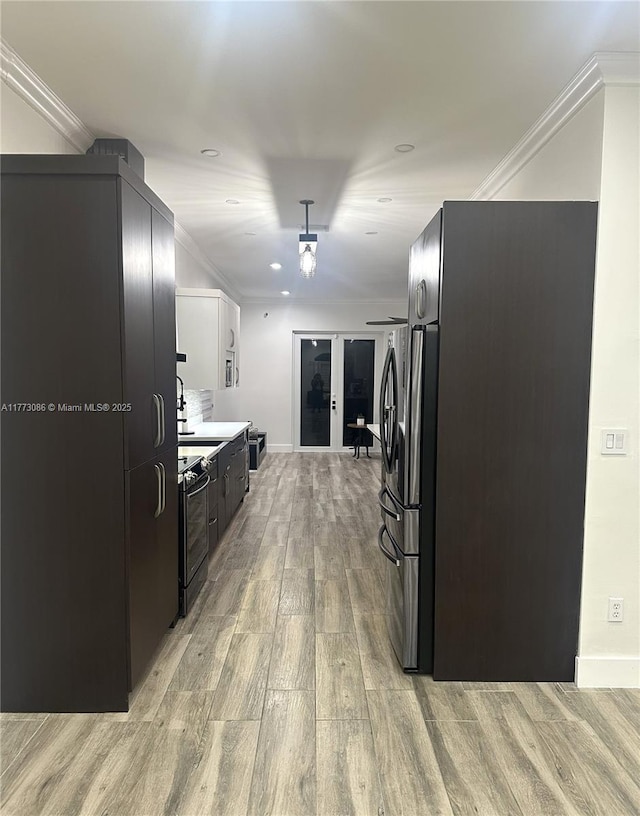 11845 SW 3rd St, Miami, FL 33184 - kitchen with freestanding refrigerator, light wood finished floors, black electric range oven, modern cabinets, and ornamental molding