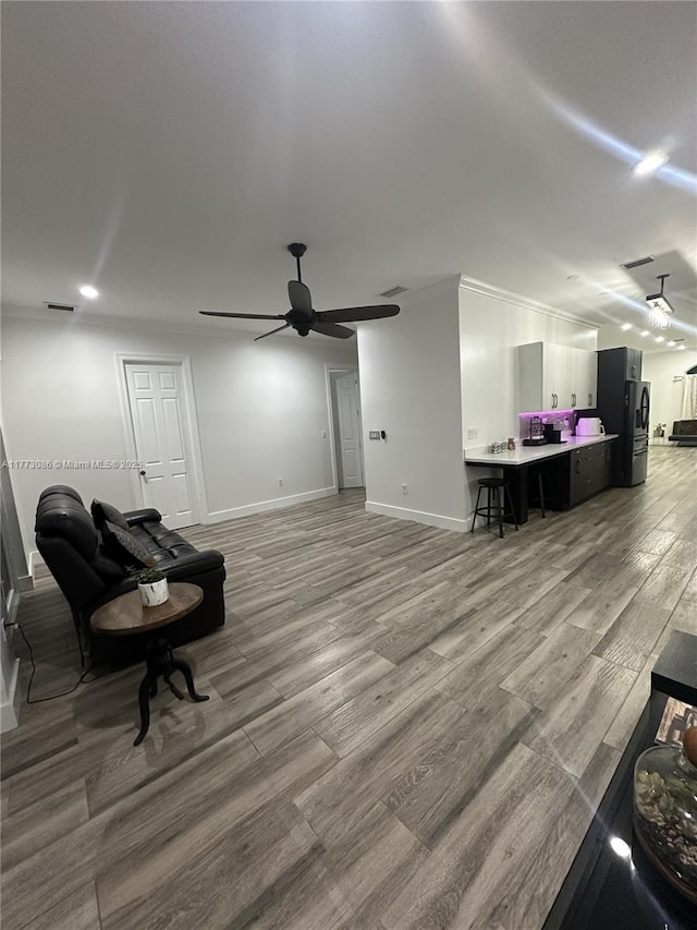 11845 SW 3rd St, Miami, FL 33184 - interior space with visible vents, light wood-style flooring, crown molding, baseboards, and ceiling fan