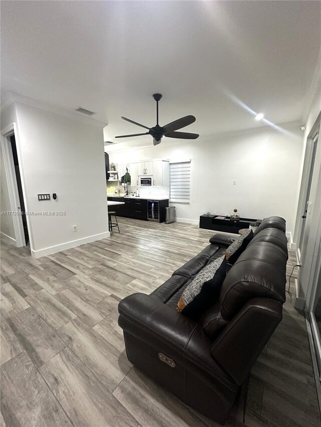 11845 SW 3rd St, Miami, FL 33184 - living area with baseboards, light wood-type flooring, visible vents, and a ceiling fan