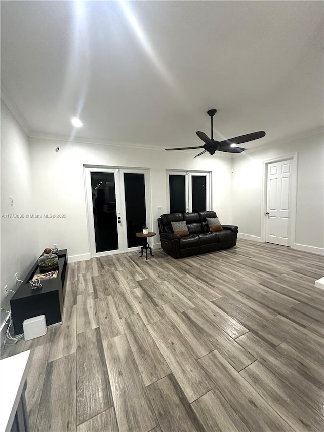 11845 SW 3rd St, Miami, FL 33184 - living area with baseboards, crown molding, wood finished floors, and ceiling fan