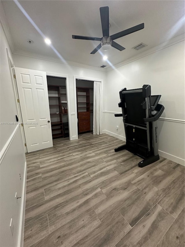 11845 SW 3rd St, Miami, FL 33184 - bedroom with crown molding, wood finished floors, baseboards, visible vents, and two closets