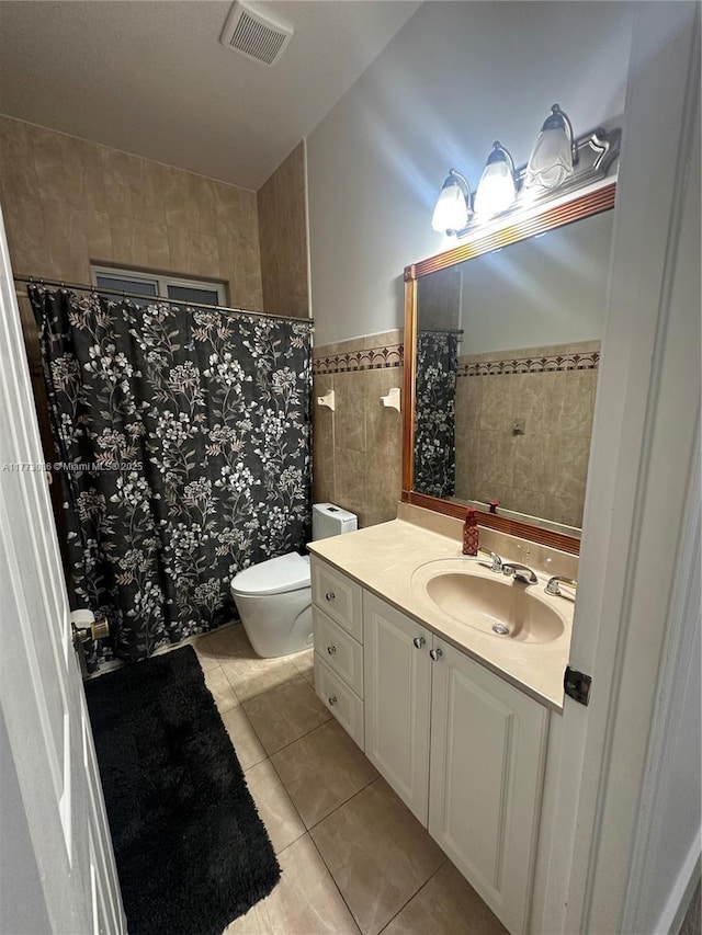 11845 SW 3rd St, Miami, FL 33184 - bathroom with tile patterned flooring, vanity, tile walls, toilet, and visible vents