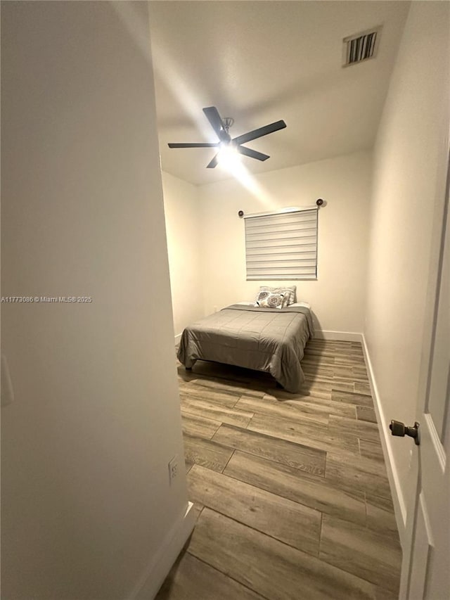11845 SW 3rd St, Miami, FL 33184 - bedroom with baseboards, ceiling fan, visible vents, and wood finished floors