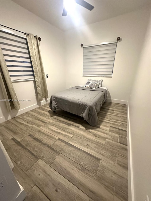11845 SW 3rd St, Miami, FL 33184 - bedroom featuring baseboards, ceiling fan, and wood finished floors