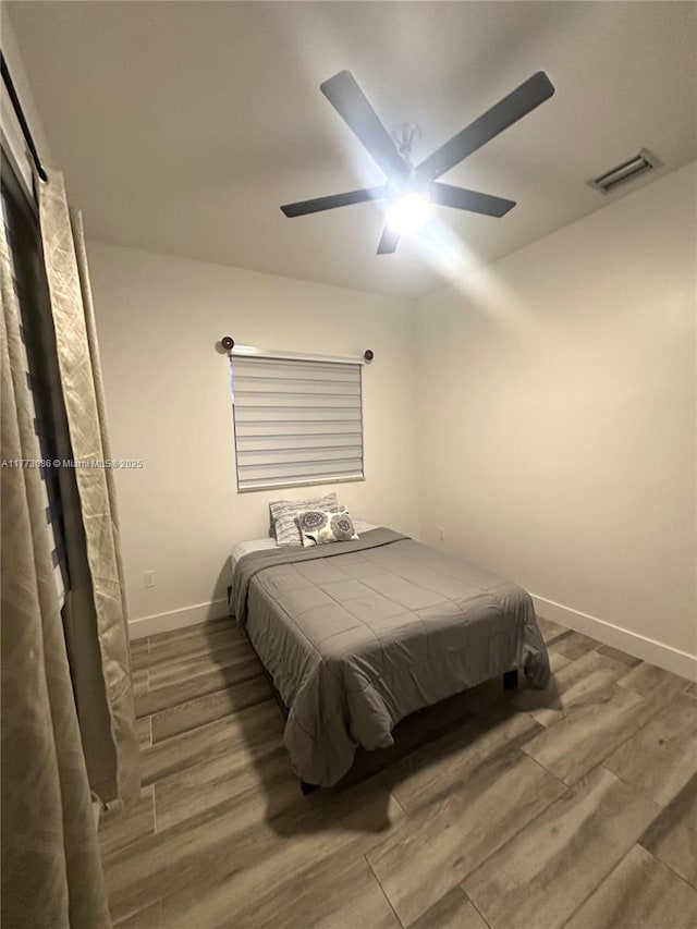 11845 SW 3rd St, Miami, FL 33184 - bedroom with baseboards, visible vents, wood finished floors, and a ceiling fan