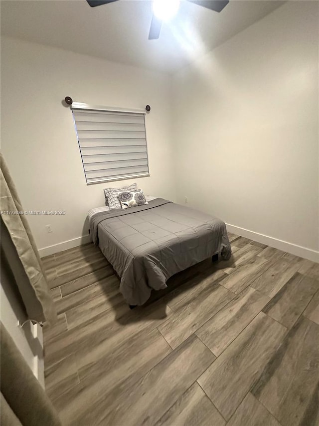11845 SW 3rd St, Miami, FL 33184 - bedroom featuring baseboards, wood finished floors, and a ceiling fan