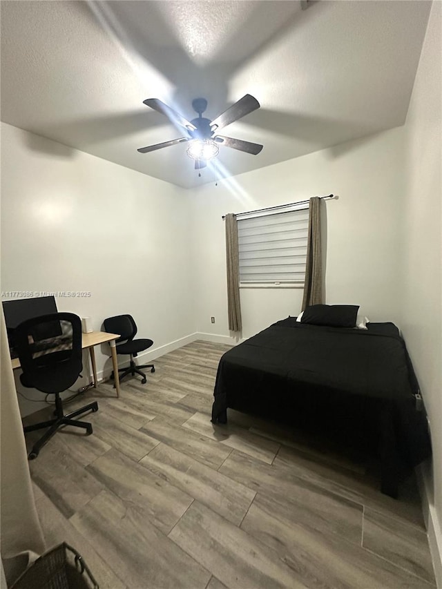 11845 SW 3rd St, Miami, FL 33184 - bedroom with a textured ceiling, wood finished floors, baseboards, and a ceiling fan