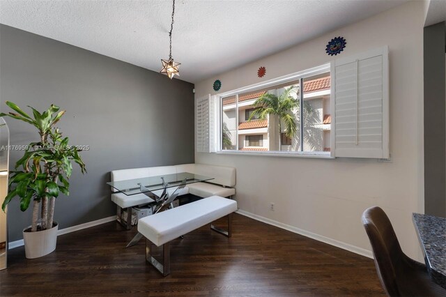 1401 NE 9th St Unit 26, Fort Lauderdale, FL 33304 - dining room with baseboards, wood finished floors, and a textured ceiling