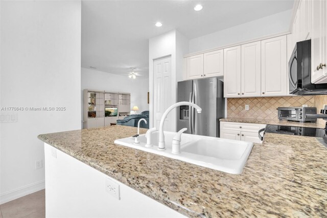 6843 Montrose Way, Boynton Beach, FL 33437 - kitchen featuring black microwave, stainless steel fridge with ice dispenser, white cabinets, a sink, and tasteful backsplash