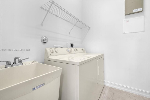 6843 Montrose Way, Boynton Beach, FL 33437 - washroom featuring washer and dryer, light tile patterned floors, and baseboards