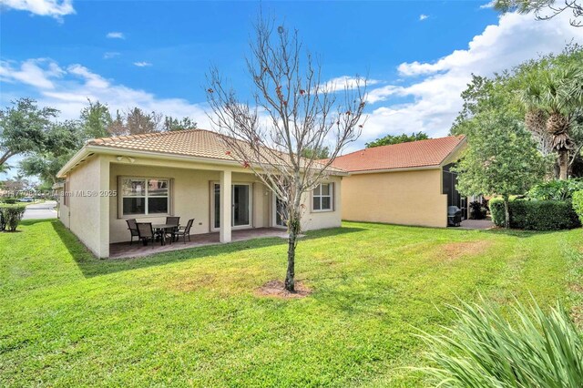 6843 Montrose Way, Boynton Beach, FL 33437 - rear view of property with stucco siding, a tile roof, a yard, and a patio