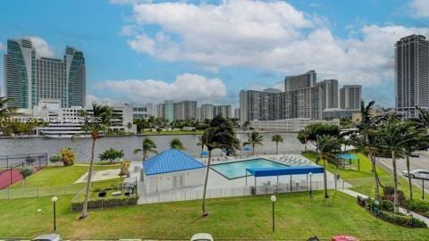 view of swimming pool featuring a city view
