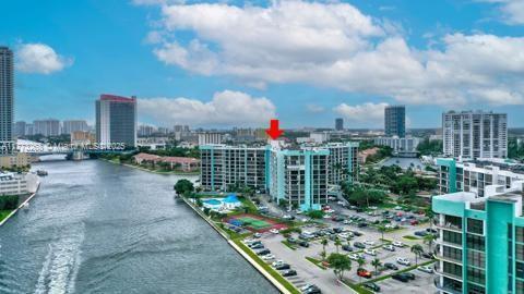 exterior space featuring a water view and a city view
