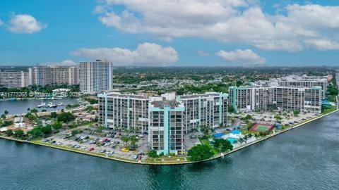 aerial view with a city view and a water view
