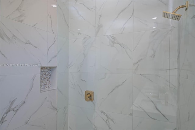 full bath with a marble finish shower