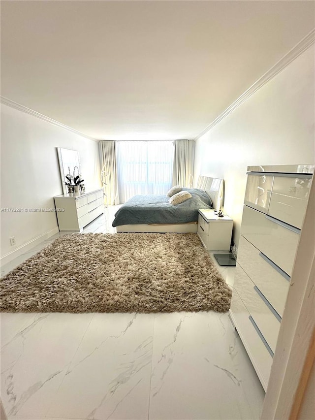 427 Golden Isles Dr Unit 5G, Hallandale Beach, FL 33009 - bedroom featuring ornamental molding, baseboards, and marble finish floor