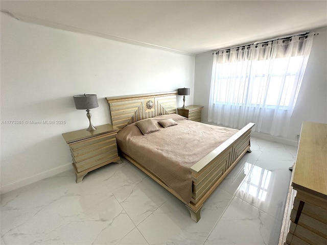 427 Golden Isles Dr Unit 5G, Hallandale Beach, FL 33009 - bedroom with marble finish floor, baseboards, and crown molding