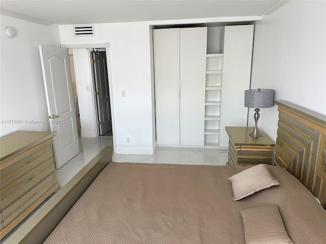 427 Golden Isles Dr Unit 5G, Hallandale Beach, FL 33009 - bedroom with visible vents, marble finish floor, and a closet