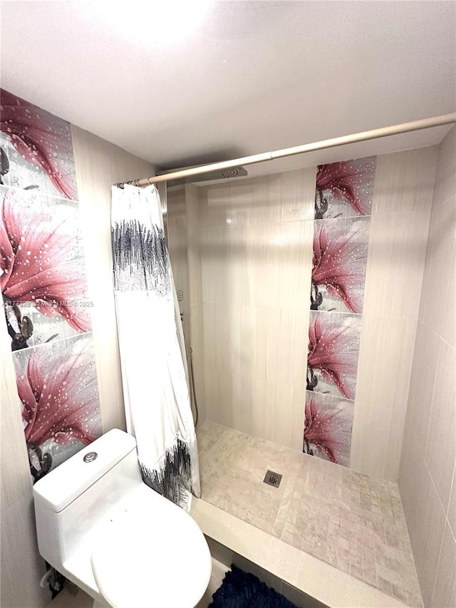 427 Golden Isles Dr Unit 5G, Hallandale Beach, FL 33009 - bathroom featuring a shower stall and toilet