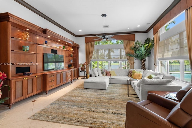 living area featuring light tile patterned floors, recessed lighting, ornamental molding, and ceiling fan