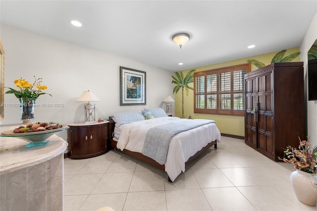 bedroom with light tile patterned flooring, baseboards, and recessed lighting