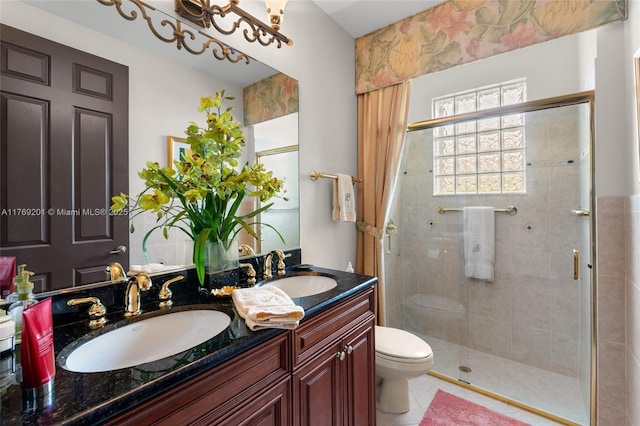 full bath with a sink and a stall shower