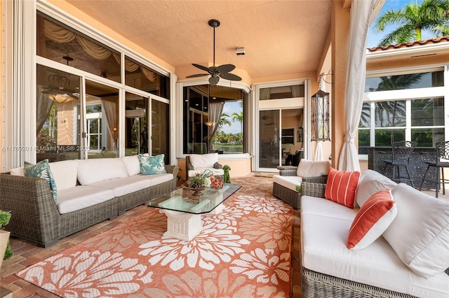 view of patio featuring an outdoor hangout area and a ceiling fan