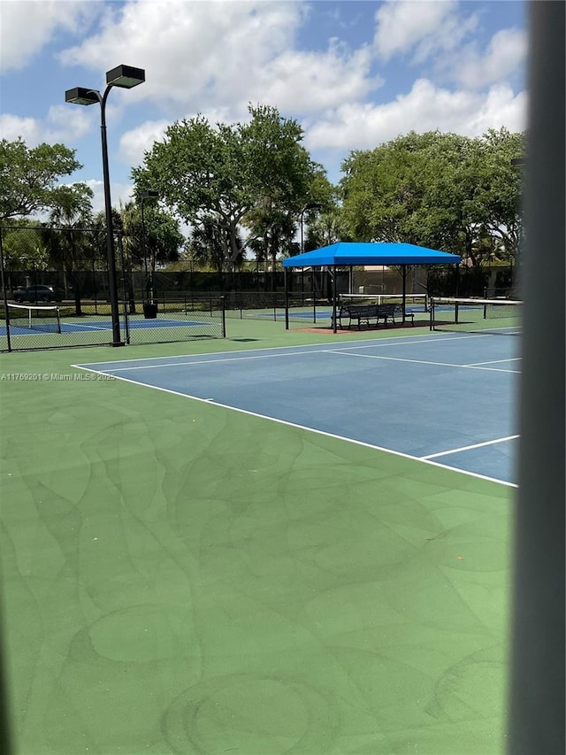 view of sport court with fence