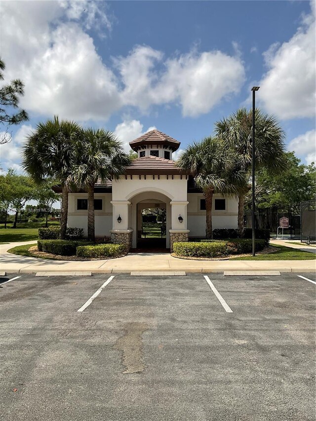 view of property with uncovered parking