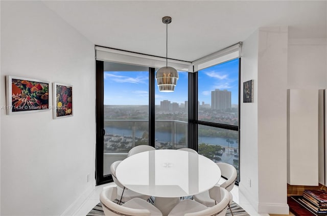 20281 E Country Club Dr Unit 1002, Aventura, FL 33180 - dining space featuring floor to ceiling windows, healthy amount of natural light, a water view, and a view of city