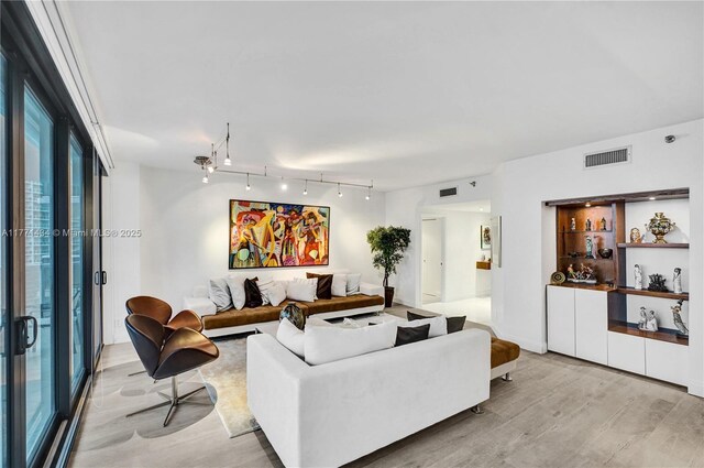 20281 E Country Club Dr Unit 1002, Aventura, FL 33180 - living room featuring wood finished floors and rail lighting