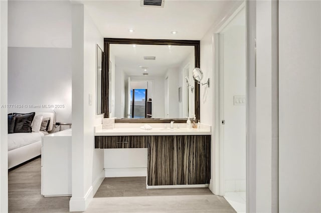 20281 E Country Club Dr Unit 1002, Aventura, FL 33180 - bathroom featuring connected bathroom, wood finished floors, and vanity