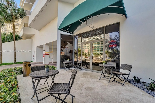 20281 E Country Club Dr Unit 1002, Aventura, FL 33180 - view of patio / terrace featuring french doors