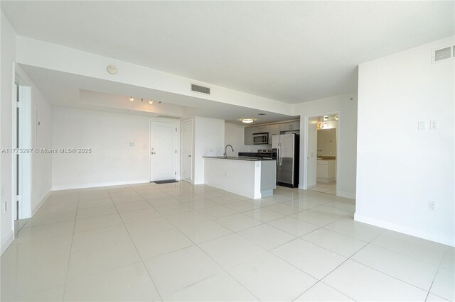 1861 NW S River Dr Unit 1904, Miami, FL 33125 - unfurnished living room with light tile patterned flooring, baseboards, and visible vents