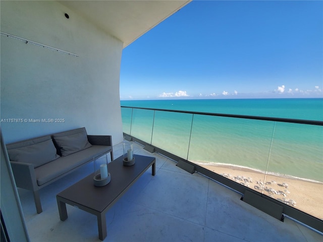 16901 Collins Ave Unit 1404, Sunny Isles Beach, FL 33160 - balcony with view of water and beach and an outdoor living space