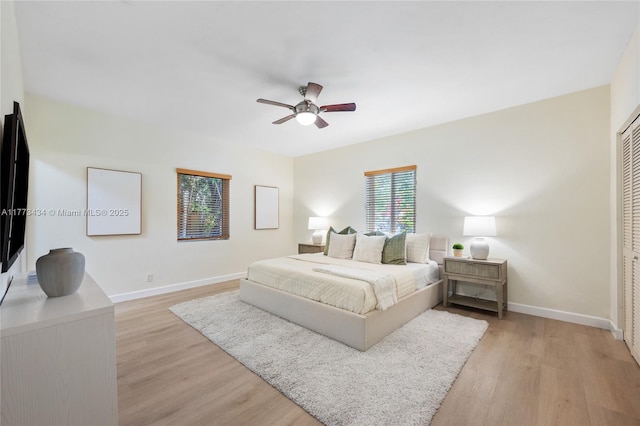 74 NE 103rd St, Miami Shores, FL 33138 - bedroom featuring light wood-style floors, baseboards, and a ceiling fan