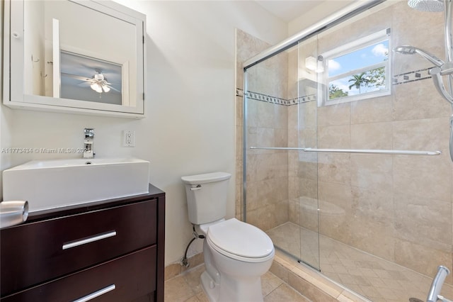 74 NE 103rd St, Miami Shores, FL 33138 - full bathroom with toilet, a shower stall, vanity, a ceiling fan, and tile patterned flooring