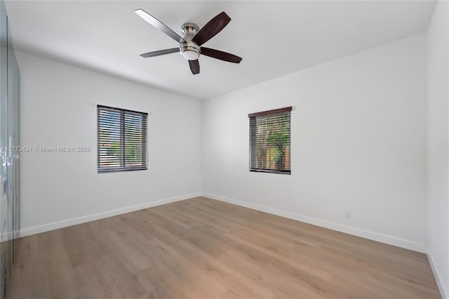 74 NE 103rd St, Miami Shores, FL 33138 - unfurnished room with plenty of natural light, light wood finished floors, and a ceiling fan