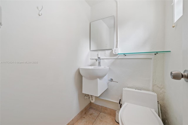 74 NE 103rd St, Miami Shores, FL 33138 - bathroom featuring toilet, tile patterned floors, and baseboards