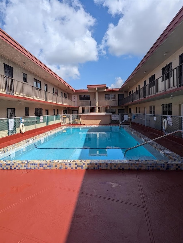 pool featuring fence