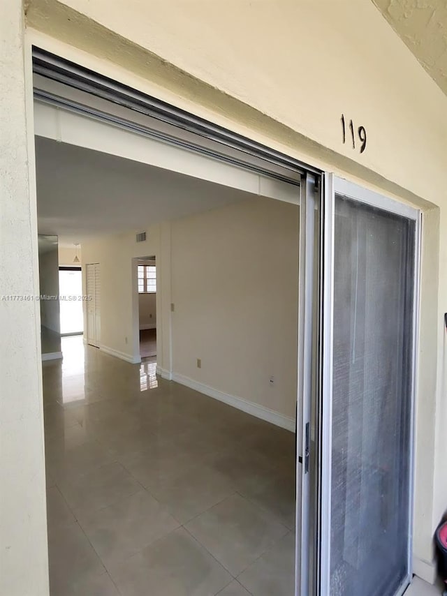 garage featuring baseboards
