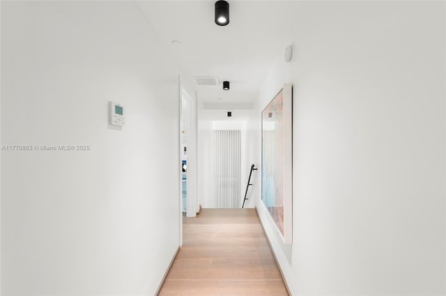 hallway featuring light wood finished floors