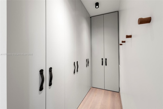hallway featuring light wood-style flooring