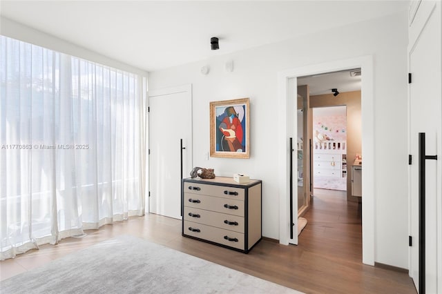 bedroom featuring wood finished floors