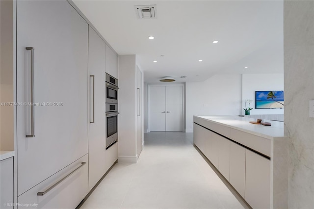 3201 S Ocean Blvd Unit 704, Highland Beach, FL 33487 - kitchen featuring modern cabinets, light countertops, and recessed lighting