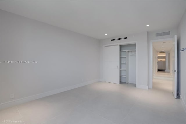 3201 S Ocean Blvd Unit 704, Highland Beach, FL 33487 - unfurnished bedroom with recessed lighting, a closet, and baseboards