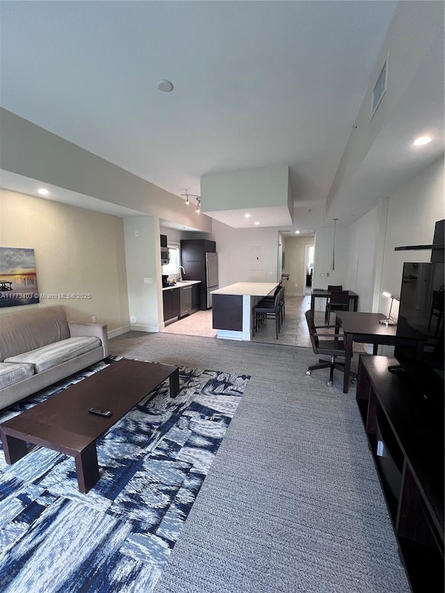 5300 NW 87th Ave Unit 916, Doral, FL 33178 - living room with light carpet, baseboards, visible vents, and recessed lighting